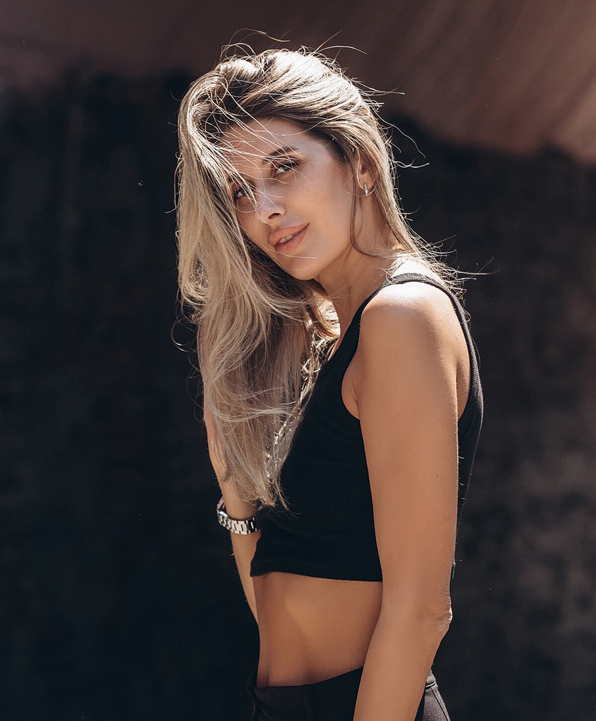 Woman with long hair in casual outfit.