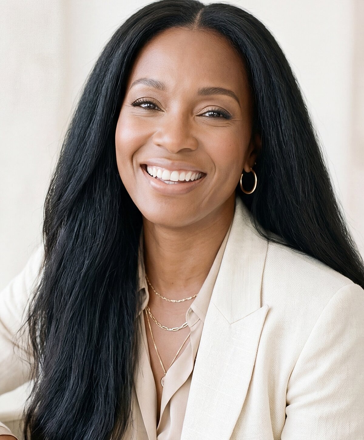 Person smiling in professional attire.